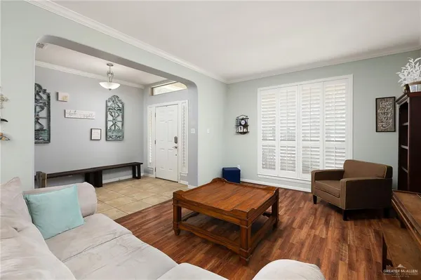 a living room with furniture rug and window