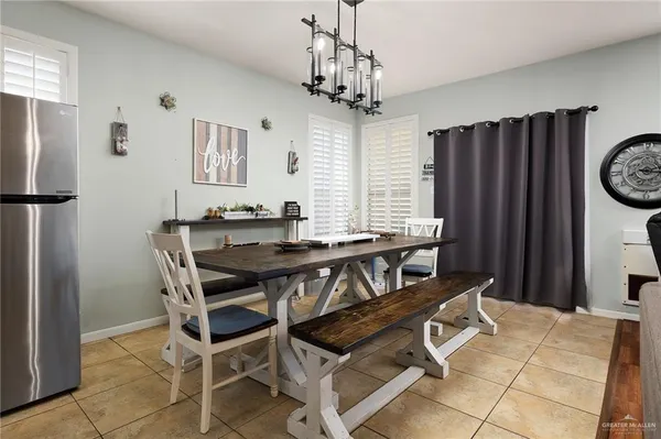 a view of a dining room with furniture and window