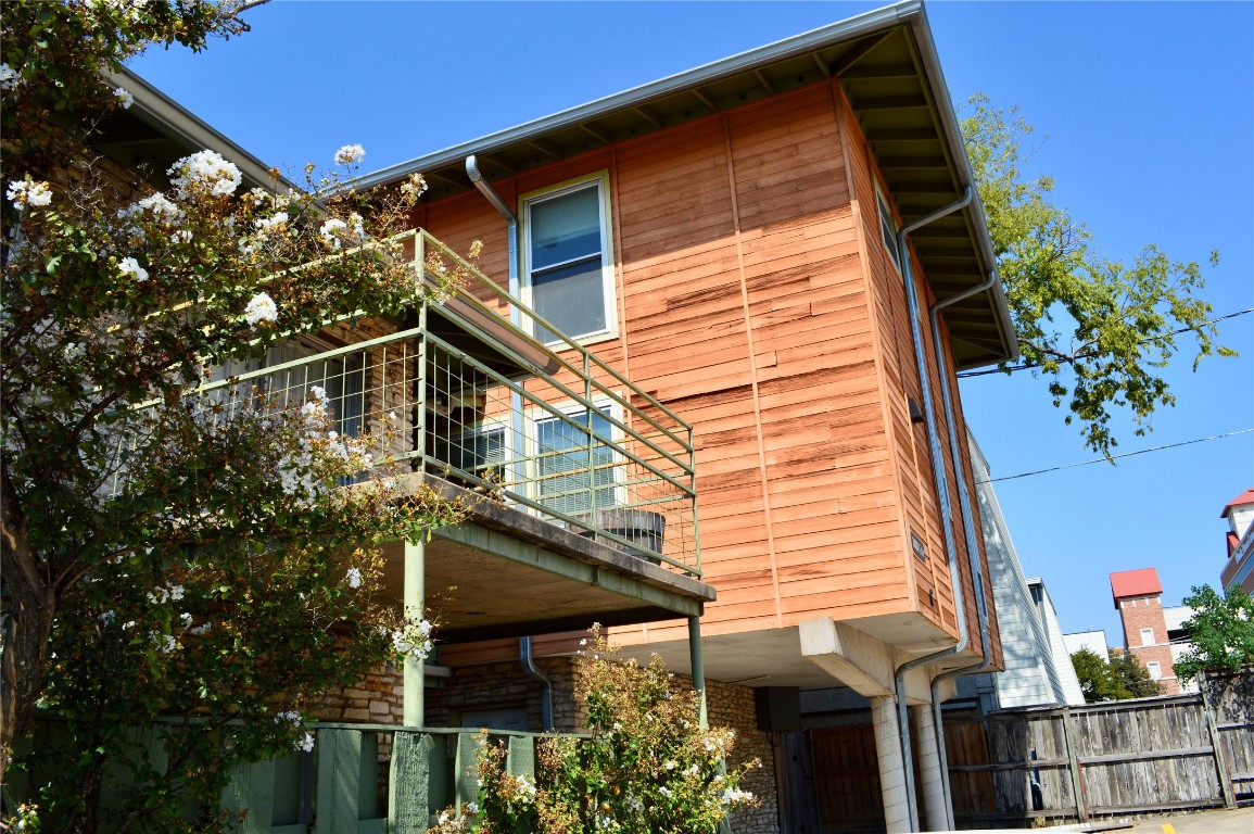 2800 Cole Street, Unit 202C Austin, TX 78705 - Photo 1 of 16 a backyard of a house with lots of green space