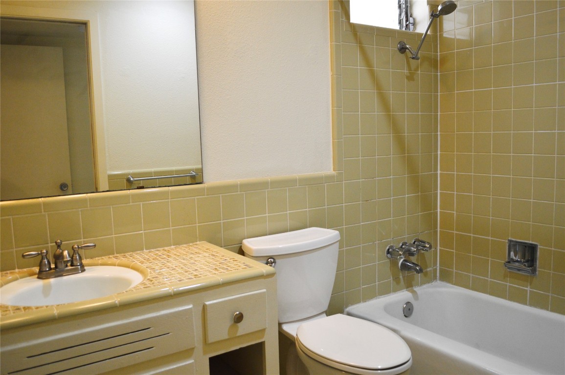 2800 Cole Street, Unit 202C Austin, TX 78705 - Photo 13 of 16 a bath room with a sink and a toilet