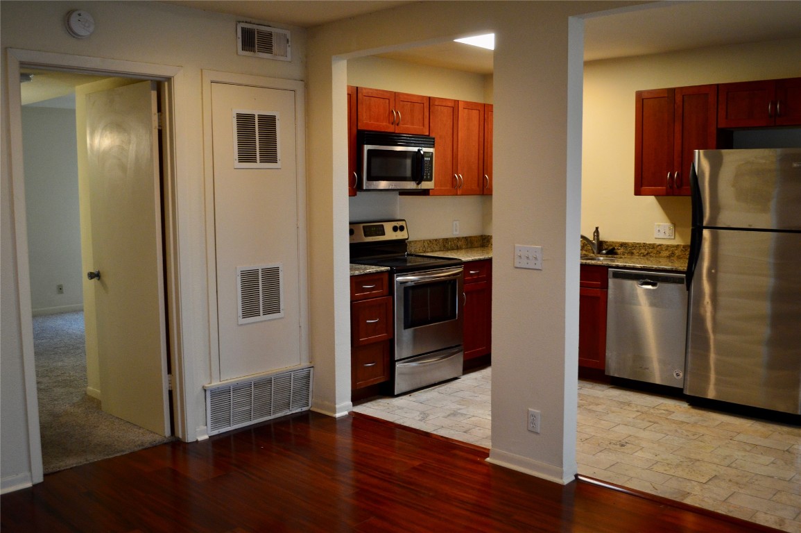 2800 Cole Street, Unit 202C Austin, TX 78705 - Photo 5 of 16 a kitchen with a refrigerator and a sink