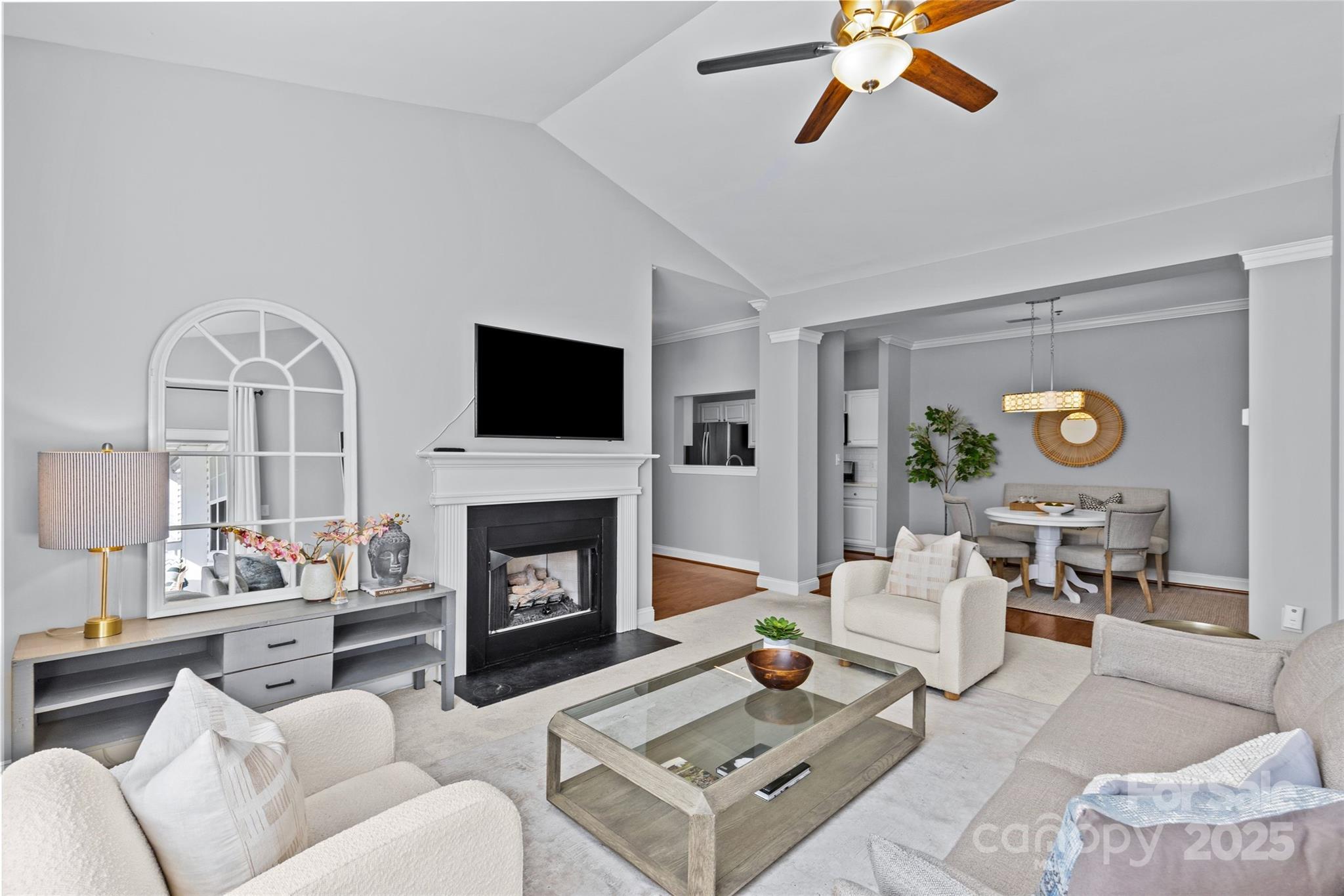 5601 Fairview Road, Unit 24 Charlotte, NC 28209 - Photo 14 of 38 a living room with furniture a fireplace and a flat screen tv