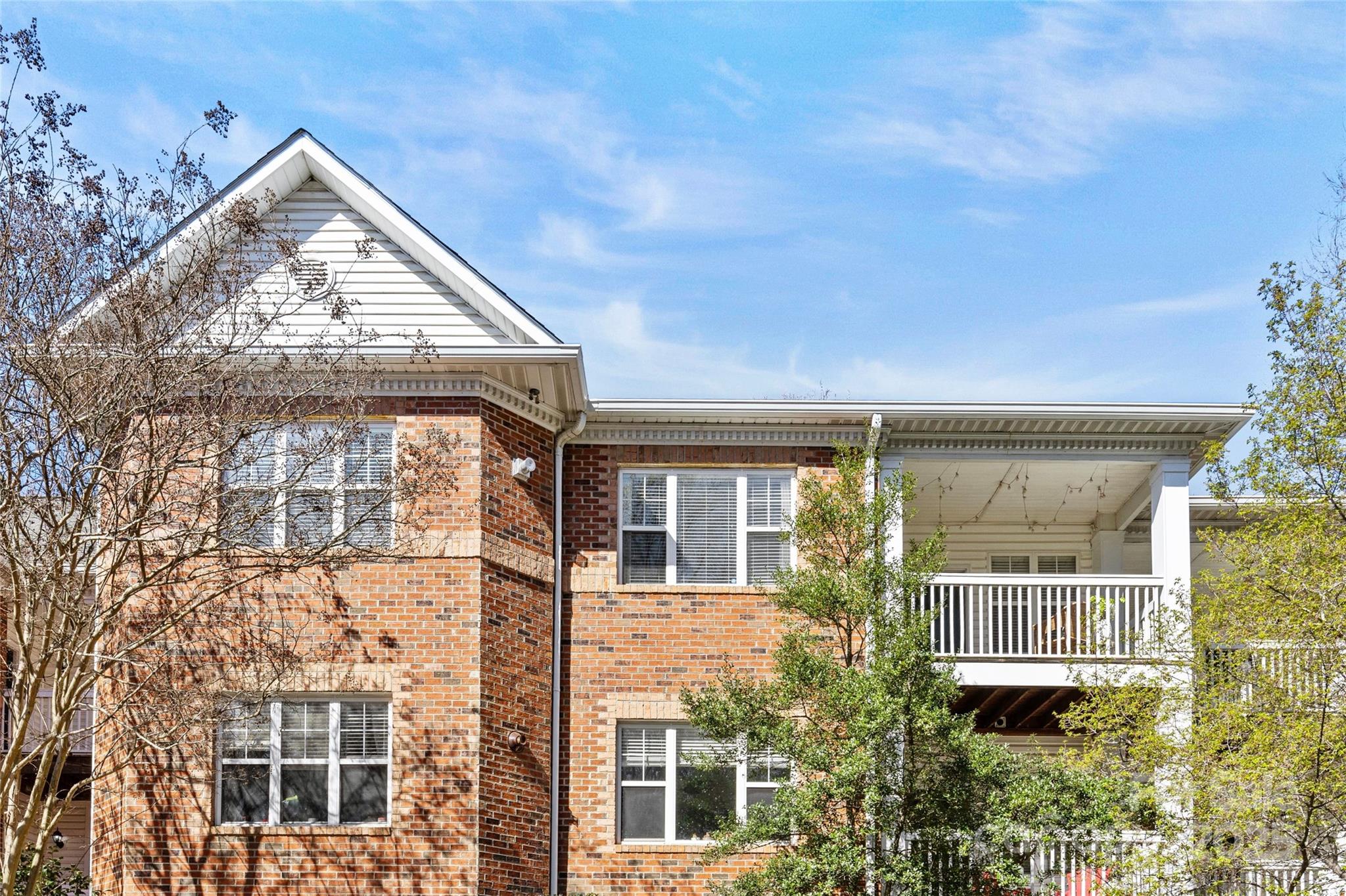 5601 Fairview Road, Unit 24 Charlotte, NC 28209 - Photo 2 of 38 front view of a brick house with large windows