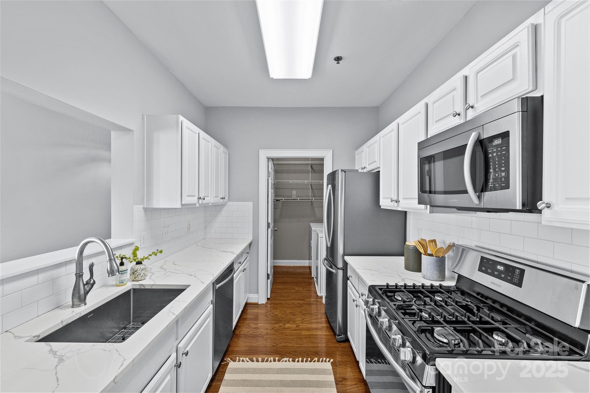 5601 Fairview Road, Unit 24 Charlotte, NC 28209 - Photo 23 of 38 a kitchen with stainless steel appliances granite countertop a stove and a sink