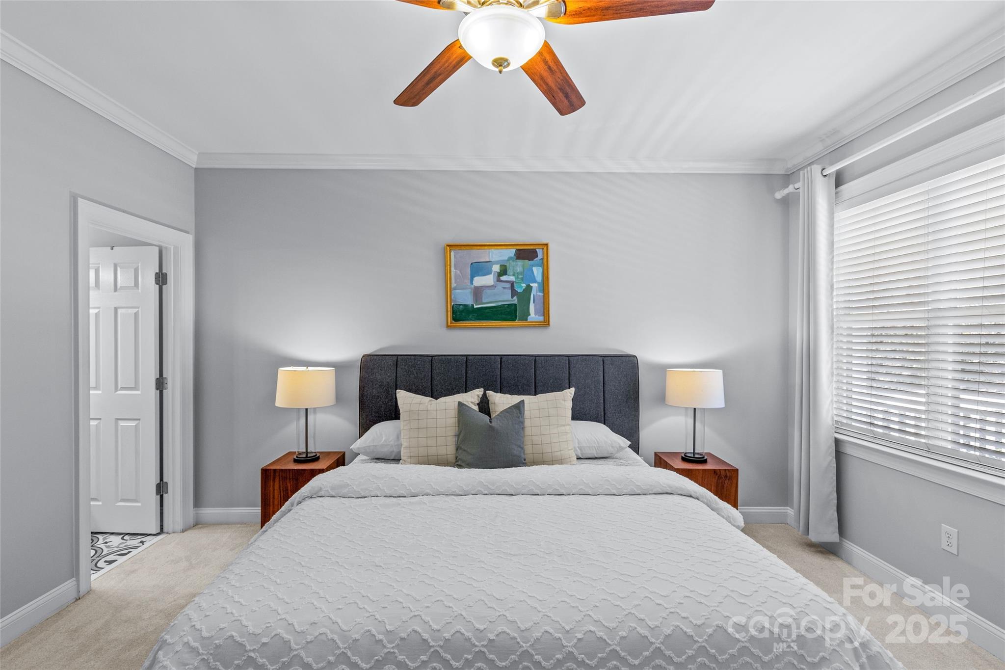 5601 Fairview Road, Unit 24 Charlotte, NC 28209 - Photo 28 of 38 a bedroom with a bed and a painting on the wall