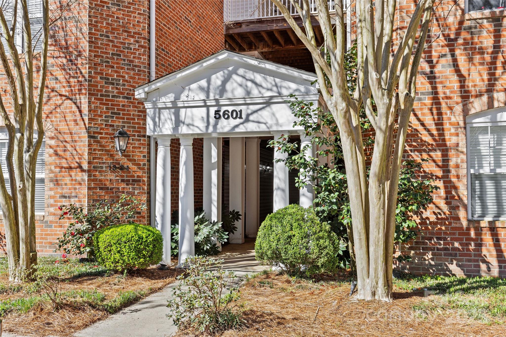 5601 Fairview Road, Unit 24 Charlotte, NC 28209 - Photo 3 of 38 a view of a house with a tree in front