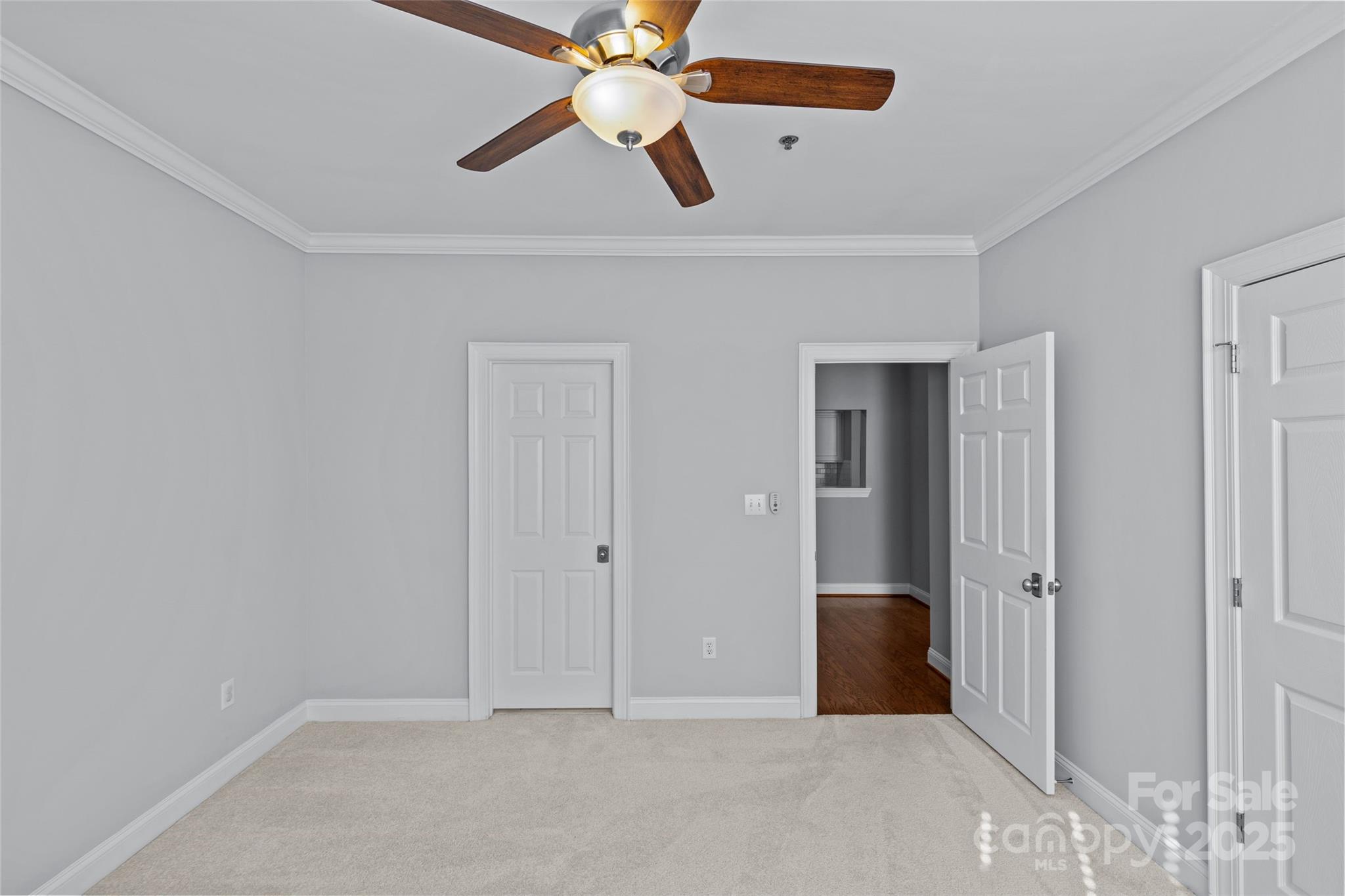 5601 Fairview Road, Unit 24 Charlotte, NC 28209 - Photo 32 of 38 an empty room with closet and a chandelier fan