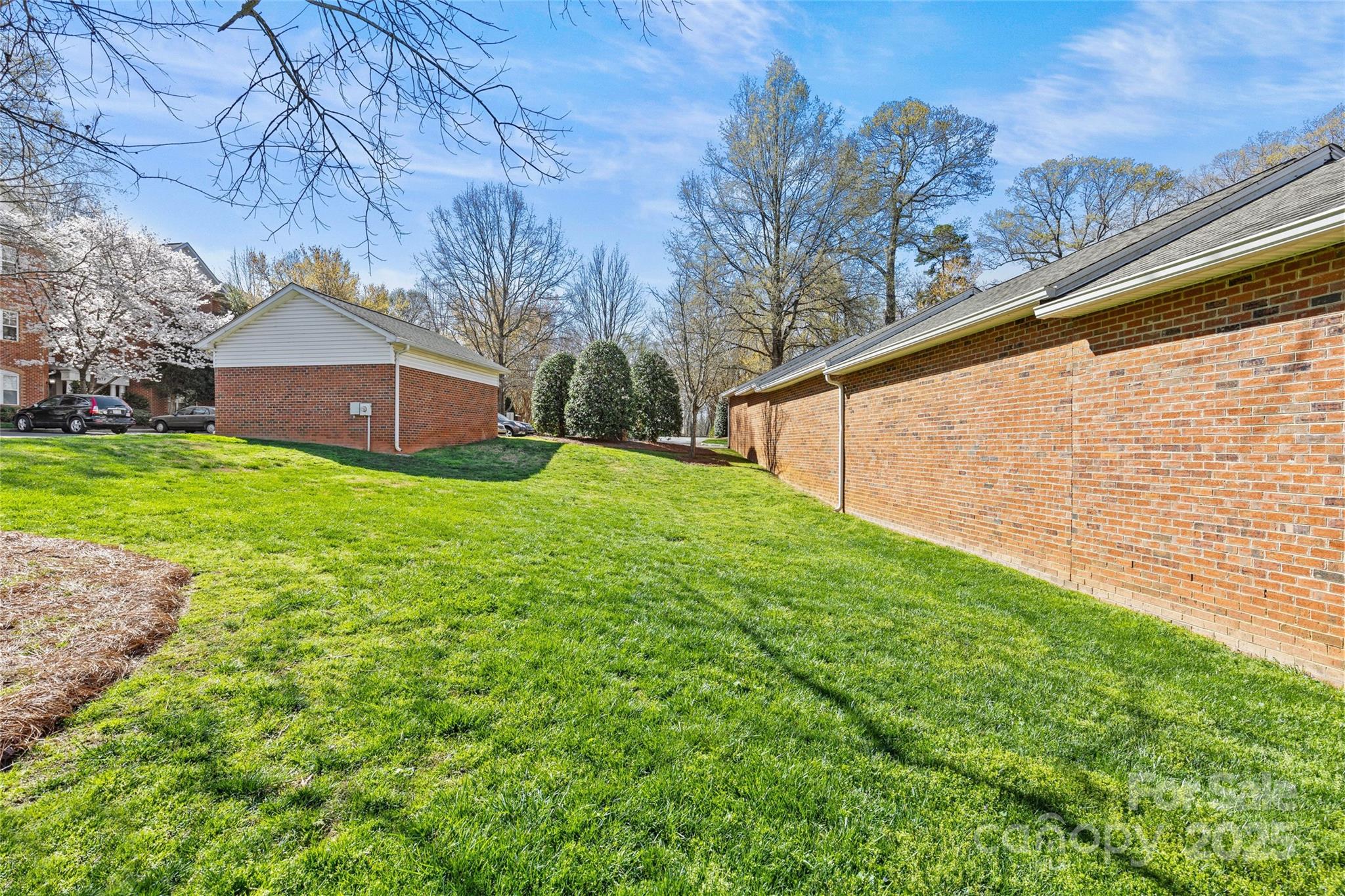 5601 Fairview Road, Unit 24 Charlotte, NC 28209 - Photo 37 of 38 a view of a house with a yard