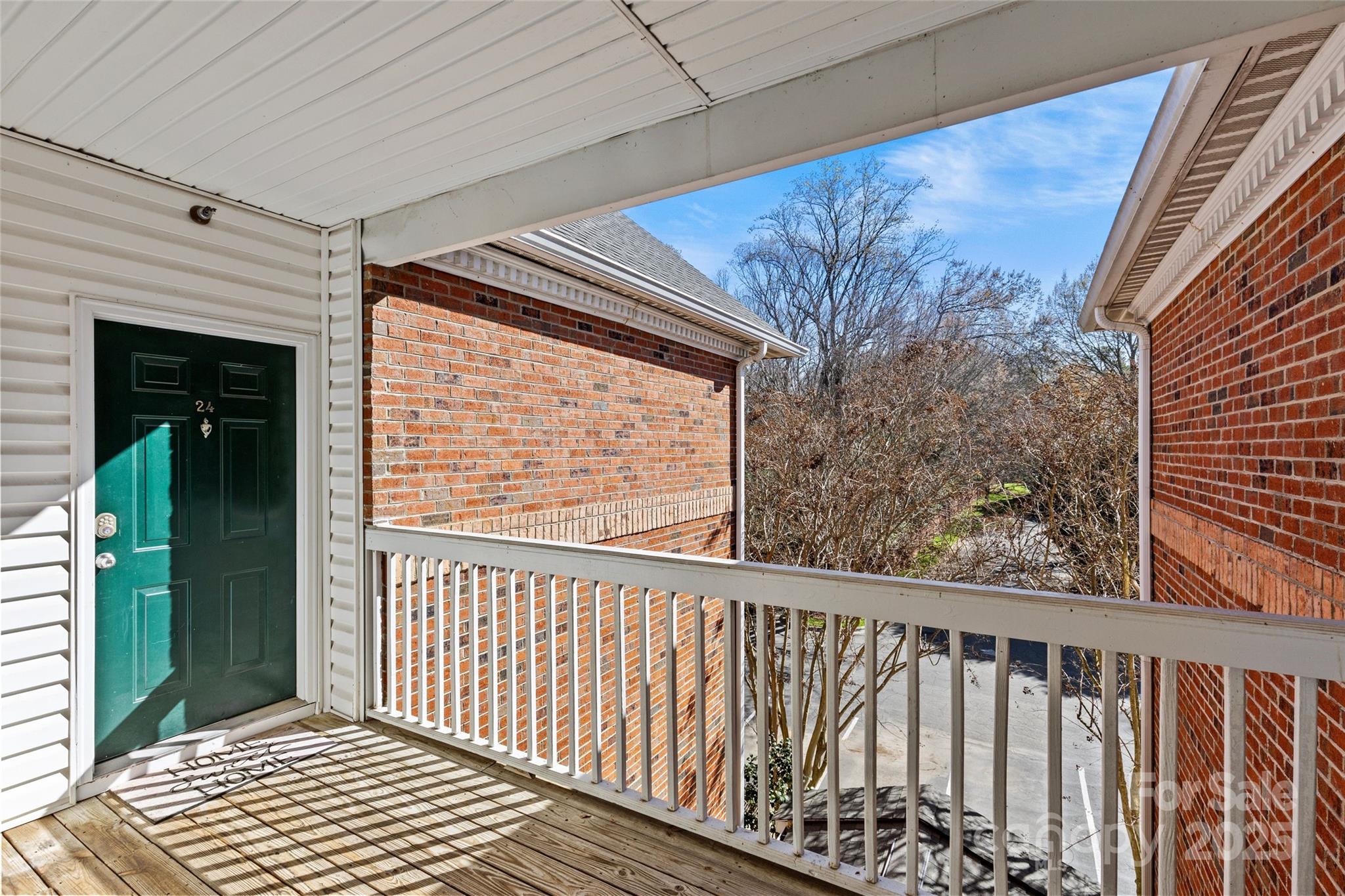 5601 Fairview Road, Unit 24 Charlotte, NC 28209 - Photo 4 of 38 a view of a balcony with wooden floor
