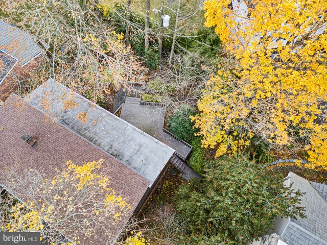 an aerial view of residential building with parking space