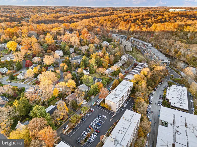front view of a house with a yard and fountain