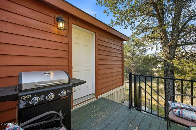 a view of a balcony with wooden floor