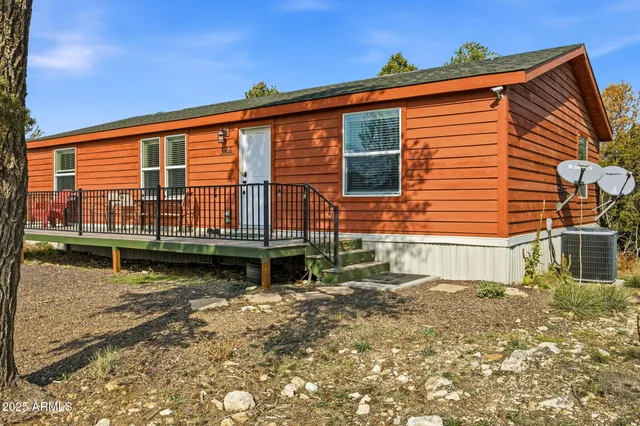 a backyard of a house with lake view and a potted plant