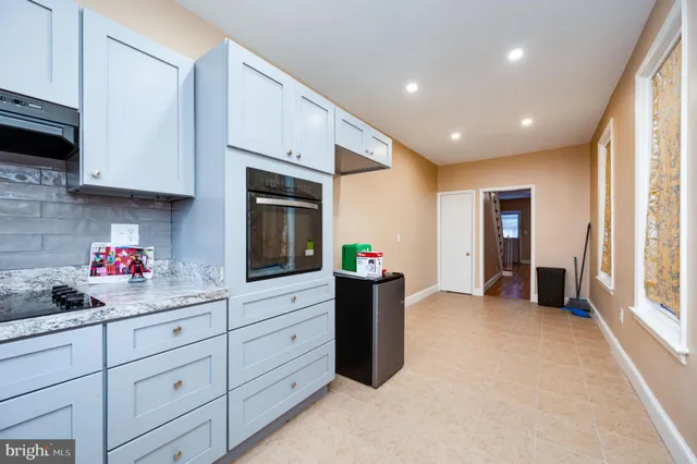 a big room with closet and wooden floor