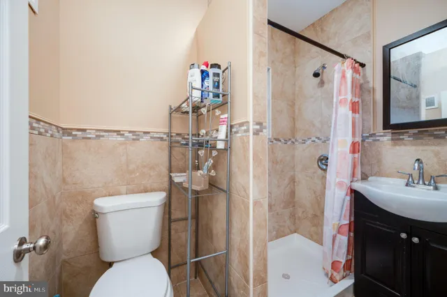 a bathroom with a sink a mirror and a shower