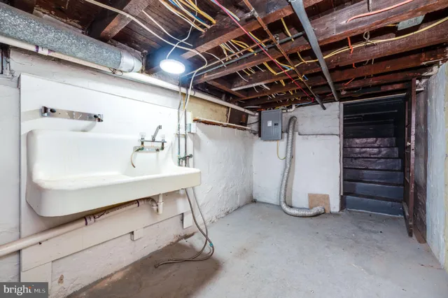 a view of a house with wooden fence