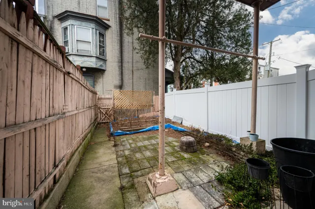 a view of a car park in front of a house