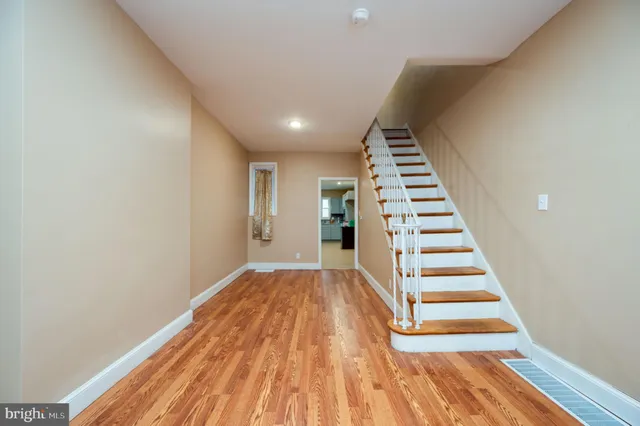 a view of entryway with wooden floor