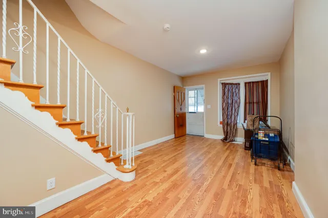 a bedroom with a bed and a mirror