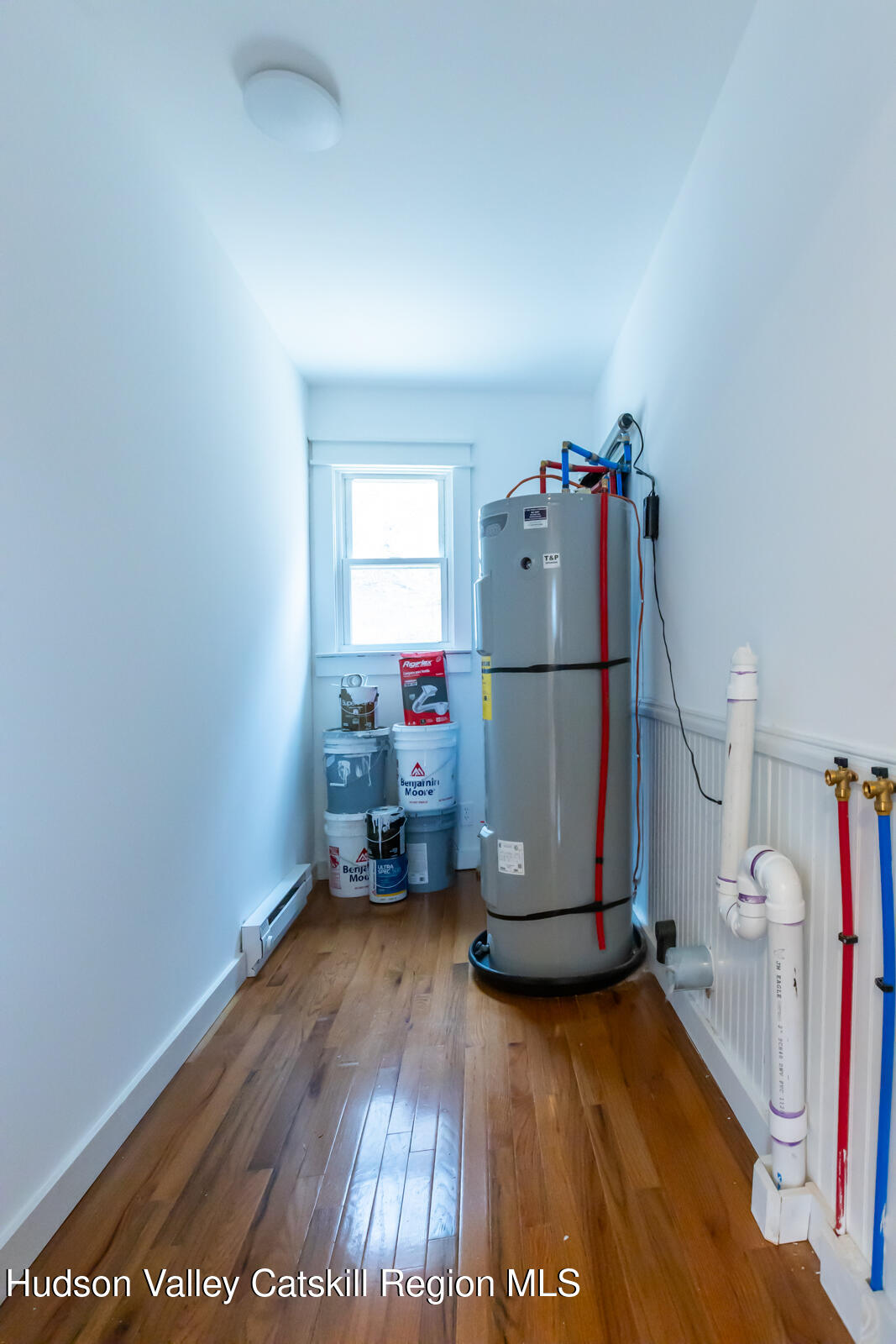 148 Esopus Creek Road Saugerties, NY 12477 - Photo 17 of 19 a view of a room with wooden floor and a sink