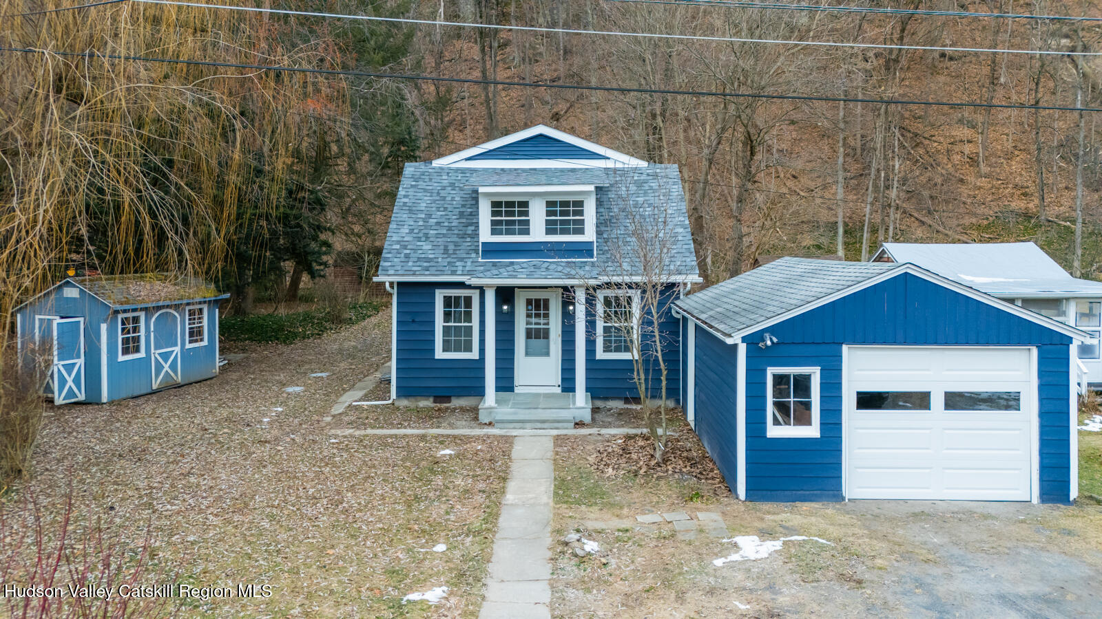148 Esopus Creek Road Saugerties, NY 12477 - Photo 2 of 19 a front view of a house with garden