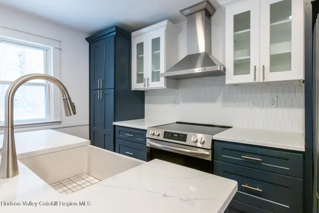a kitchen with a stove and a refrigerator