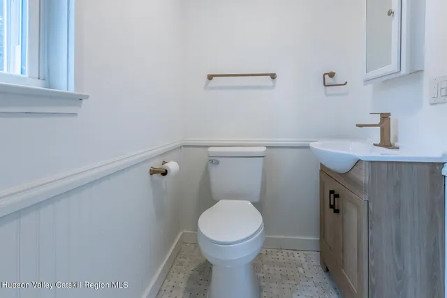 a bathroom with a toilet and a sink