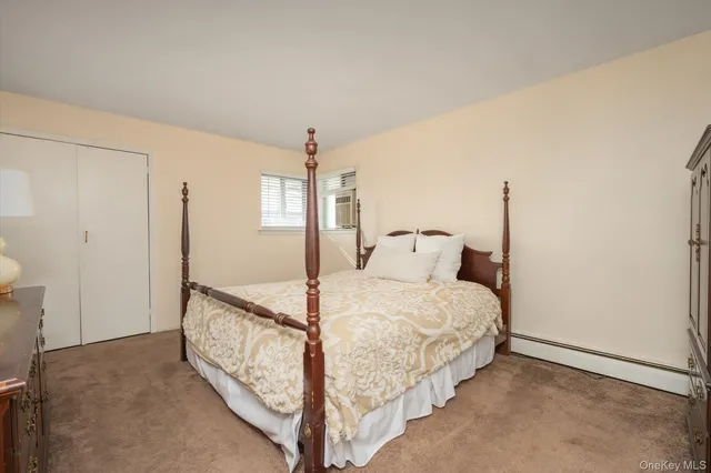 a bed room with a bed and a chandelier