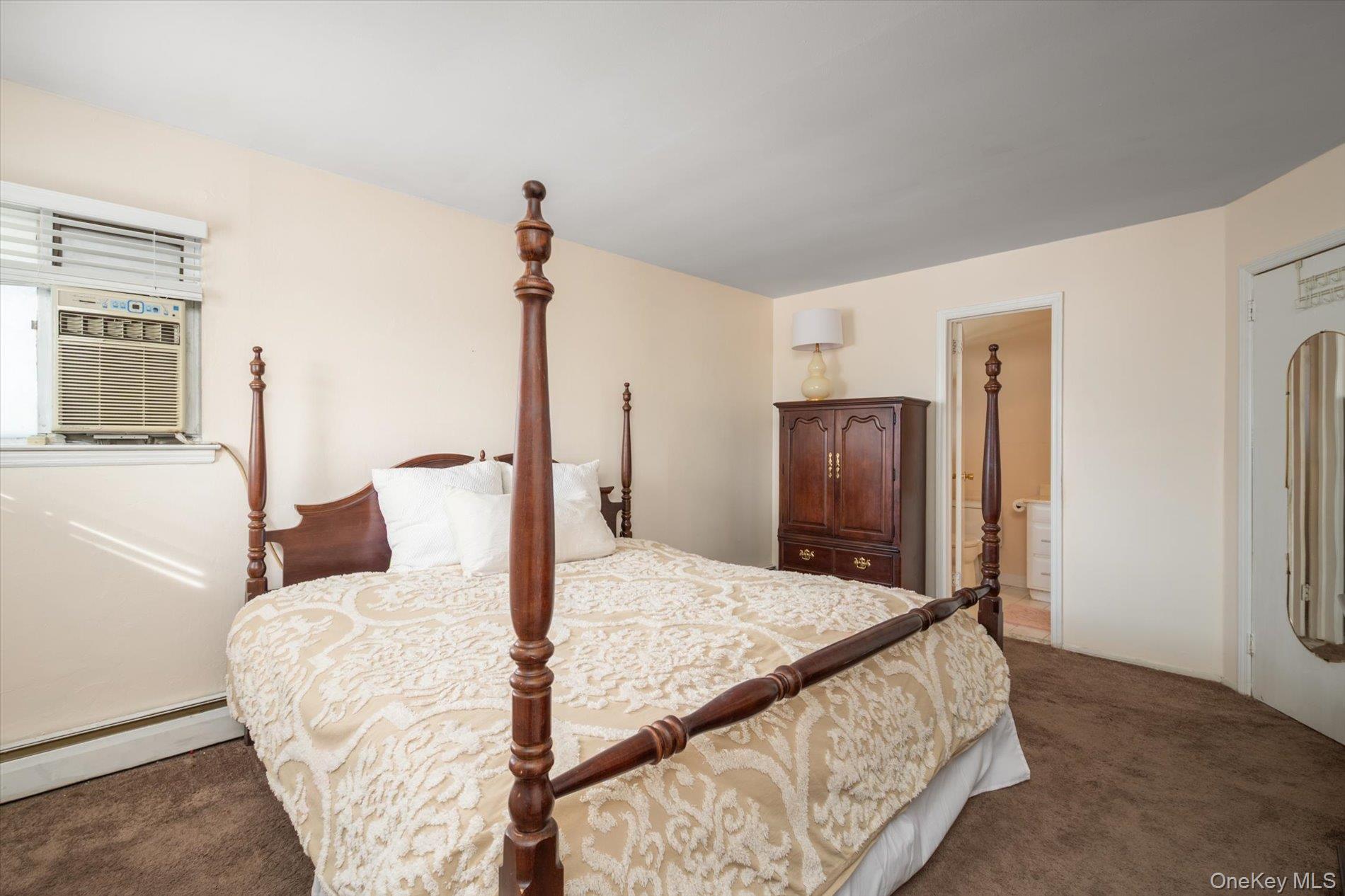 7 Stein Street Valley Stream, NY 11580 - Photo 14 of 27 Bedroom featuring dark colored carpet, cooling unit, and baseboard heating