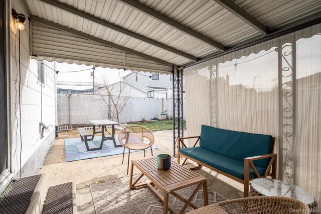 a outdoor space with patio the couches and a dining table with garden view