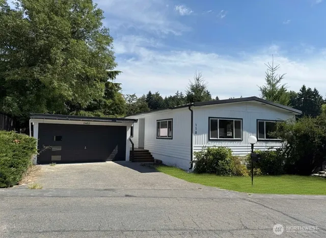 a view of a house with a yard and plants