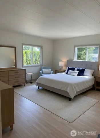 a bedroom with a bed and a couch