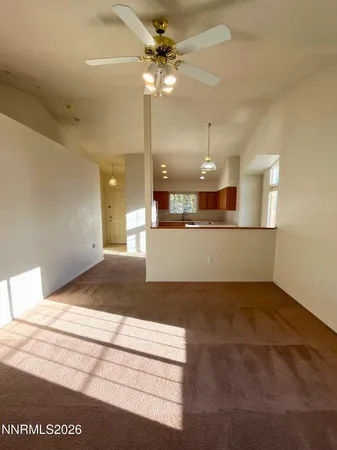 a view of a kitchen with a sink and a refrigerator