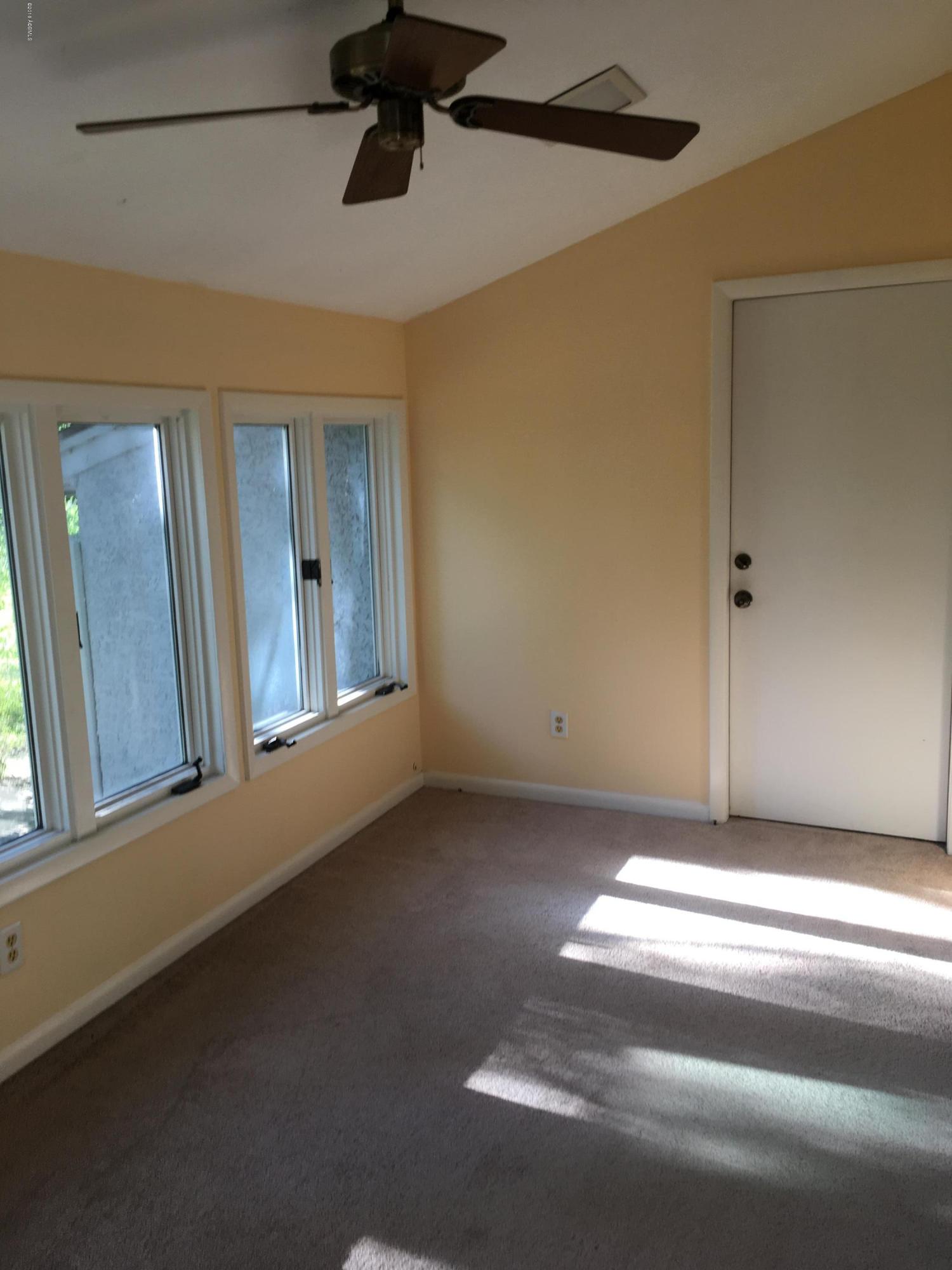 159 Brickyard Point Road South, Unit C Beaufort, SC 29907 - Photo 6 of 14 another view of sunroom off lving room