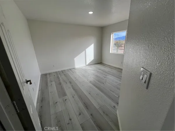 a bathroom with a double vanity sink a toilet and a mirror