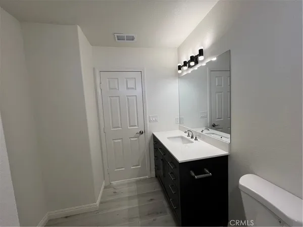 a bathroom with a toilet and a bathtub