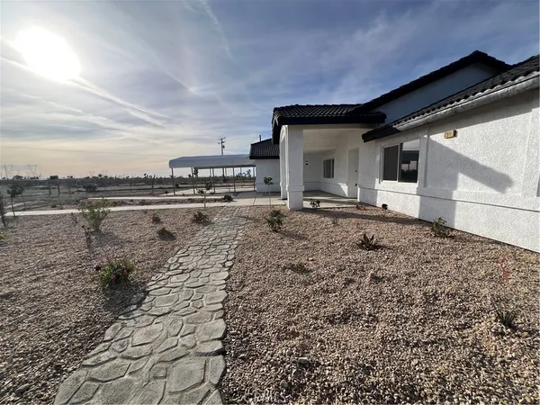 a view of a backyard of the house