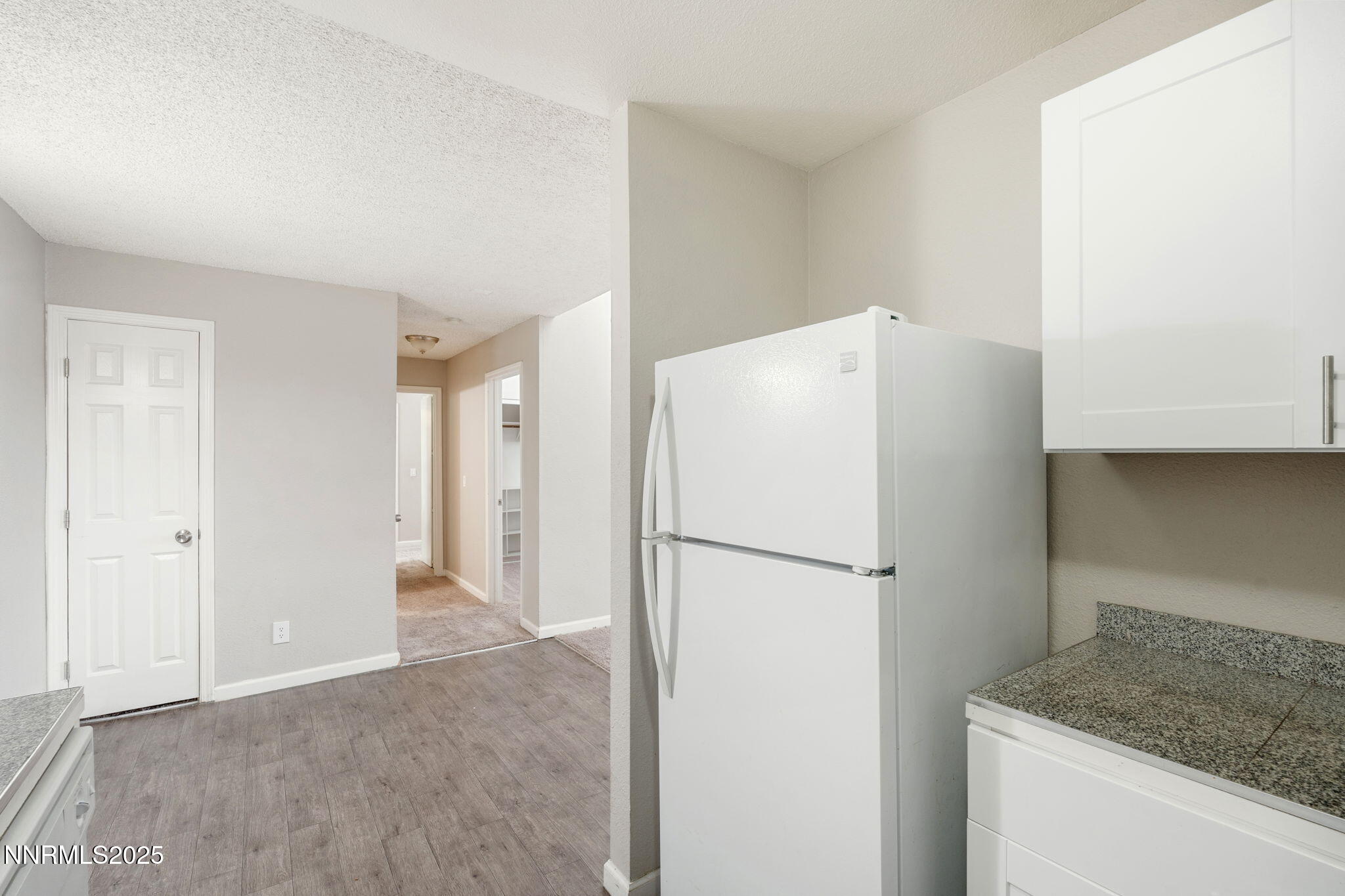2085 Highview Court, Unit 2 Reno, NV 89512 - Photo 15 of 26 a view of a kitchen with a refrigerator and a sink