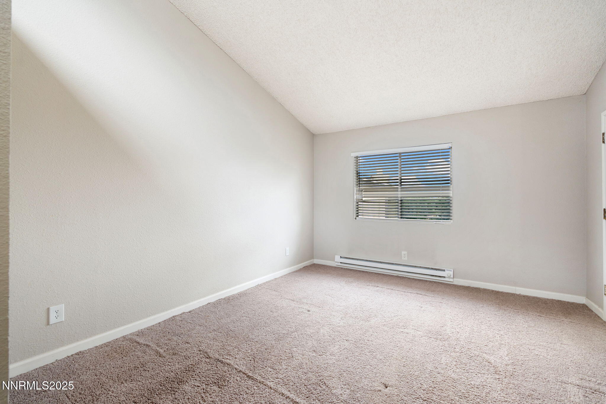 2085 Highview Court, Unit 2 Reno, NV 89512 - Photo 22 of 26 an empty room with a empty space and windows
