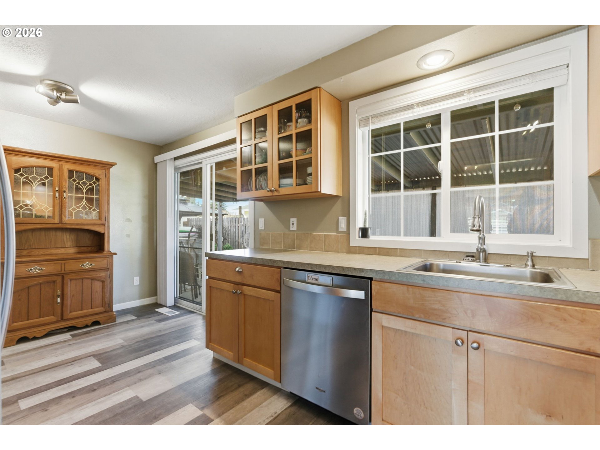 1801 North Cedar Street Newberg, OR 97132 - Photo 11 of 30 a kitchen with granite countertop a sink stove and cabinets