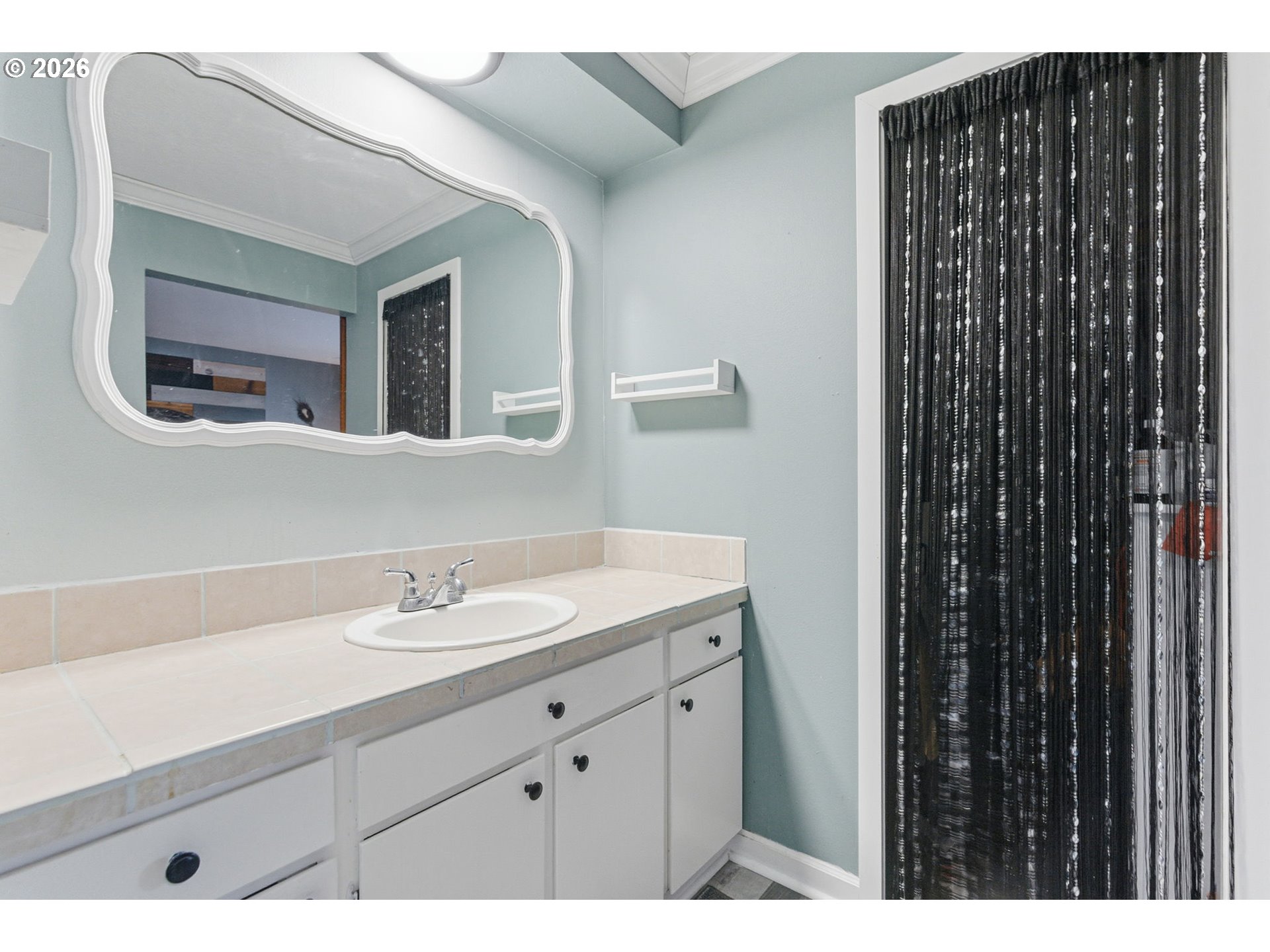 1801 North Cedar Street Newberg, OR 97132 - Photo 16 of 30 a bathroom with a sink and a mirror