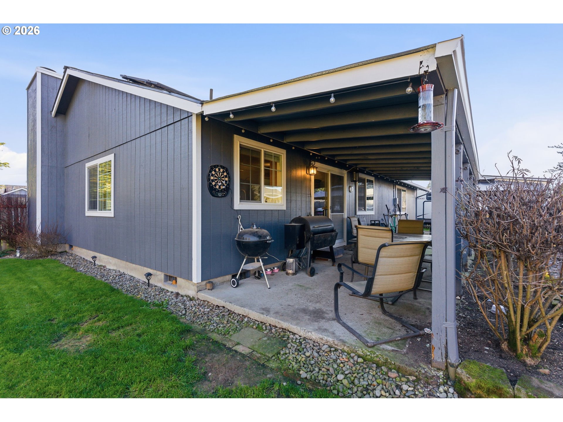 1801 North Cedar Street Newberg, OR 97132 - Photo 21 of 30 a backyard of a house with table and chairs