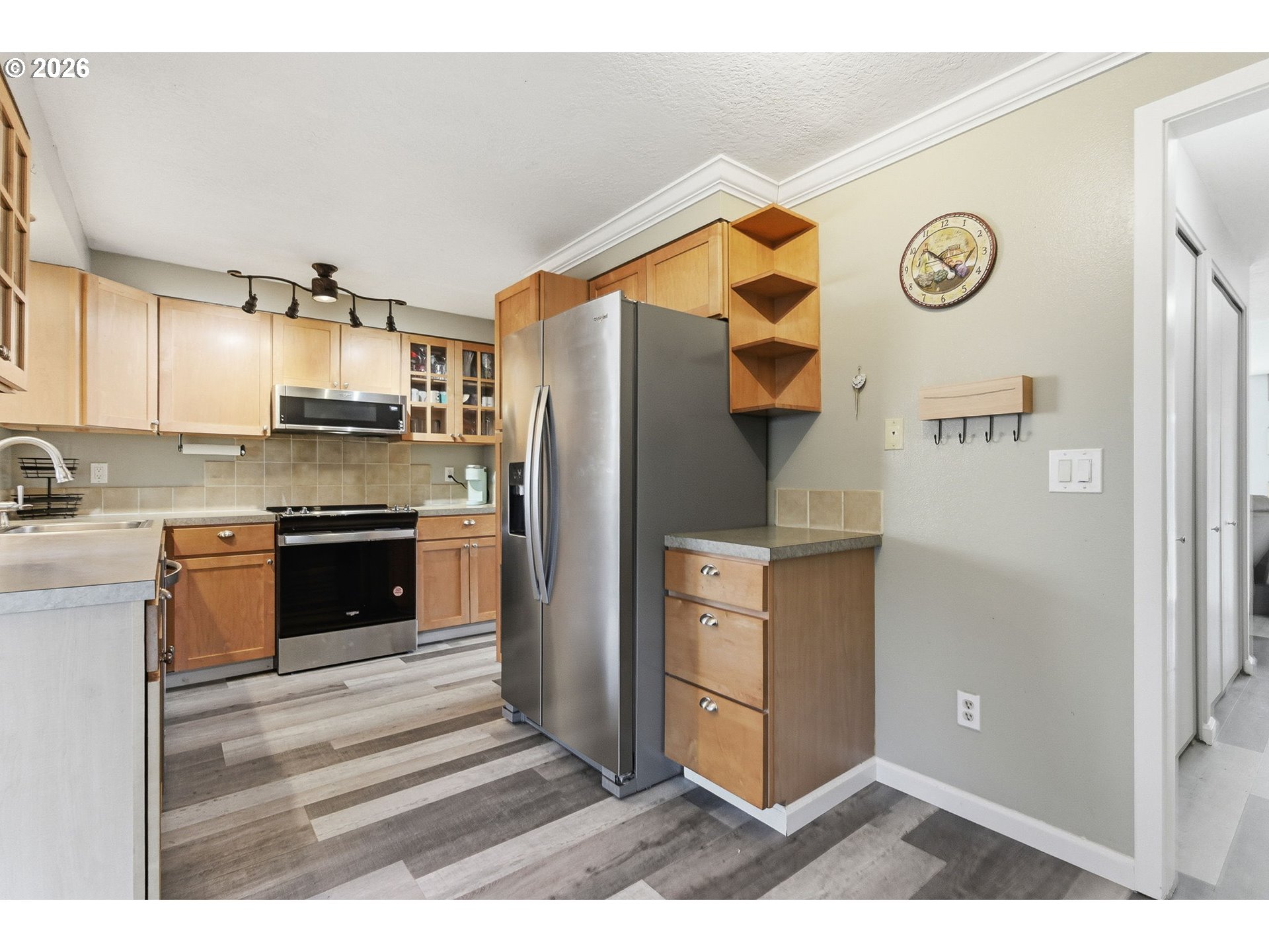 1801 North Cedar Street Newberg, OR 97132 - Photo 7 of 30 a kitchen with stainless steel appliances granite countertop a refrigerator and a stove