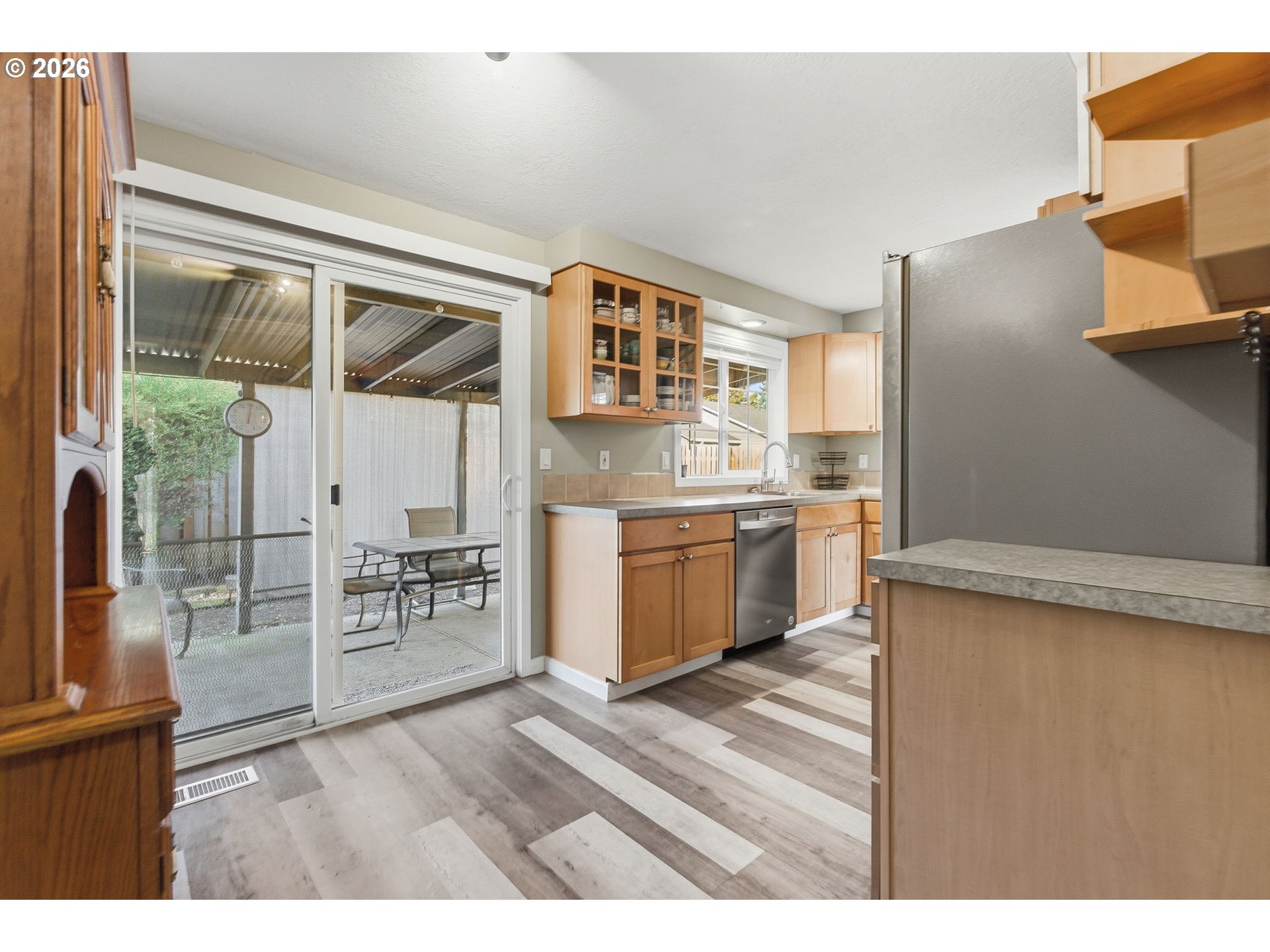 1801 North Cedar Street Newberg, OR 97132 - Photo 10 of 30 a kitchen with stainless steel appliances a stove top oven a sink and a refrigerator