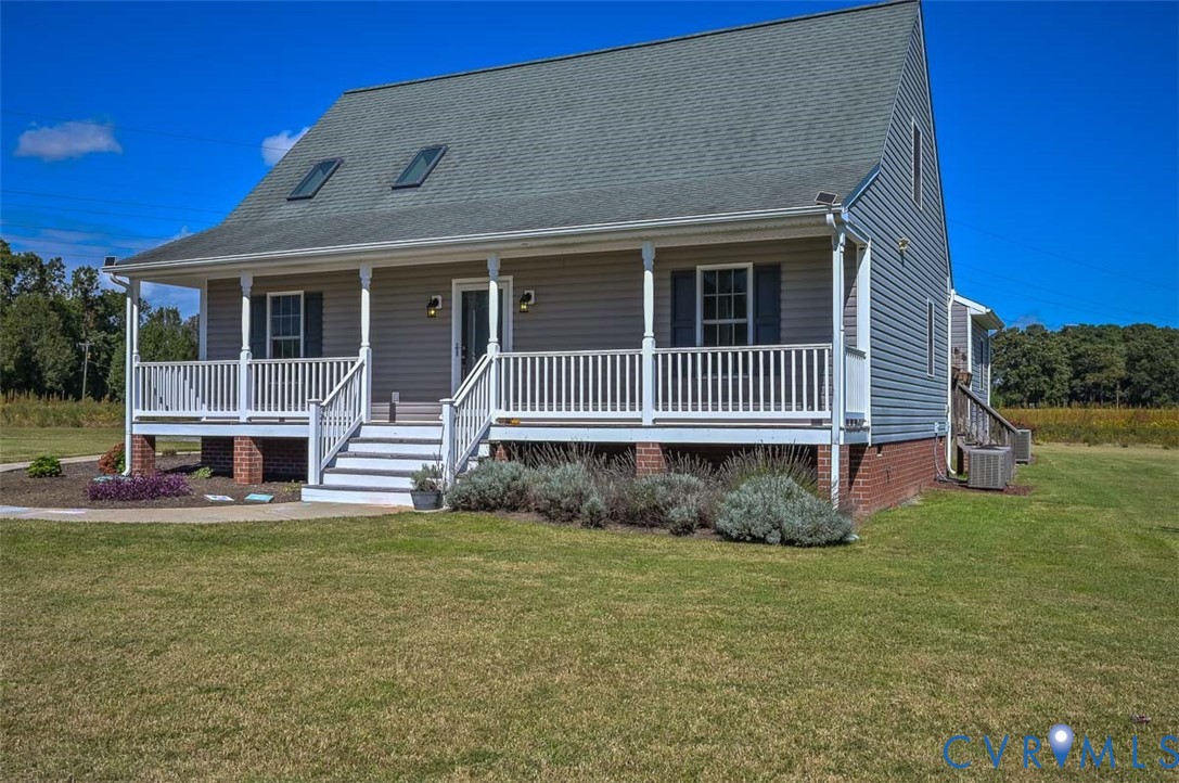 8441 Buffin Road Henrico, VA 23231 - Photo 1 of 50 a front view of a house with a garden and deck