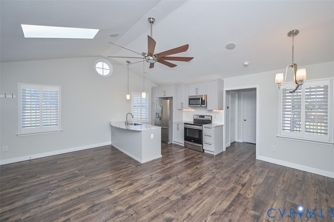 8441 Buffin Road Henrico, VA 23231 - Photo 14 of 50 a view of a kitchen with a sink wooden floor and a ceiling fan