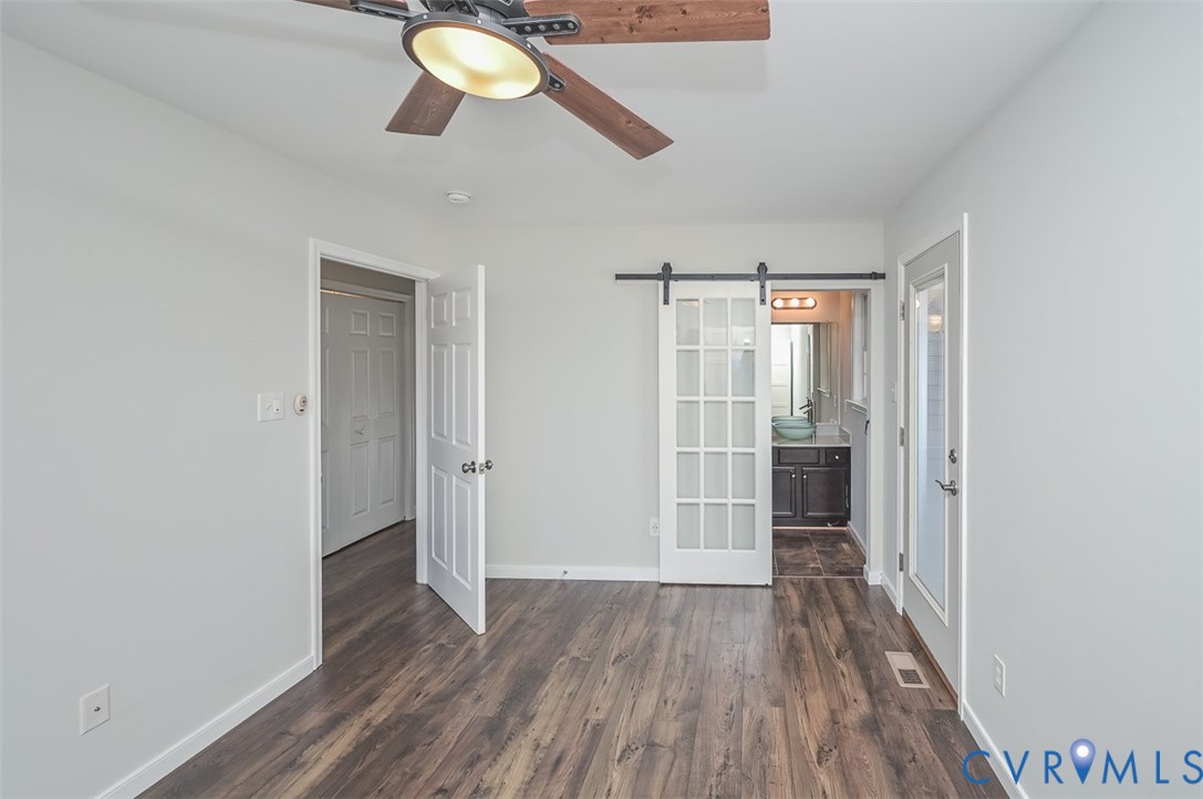 8441 Buffin Road Henrico, VA 23231 - Photo 27 of 50 wooden floor in an empty room with a window