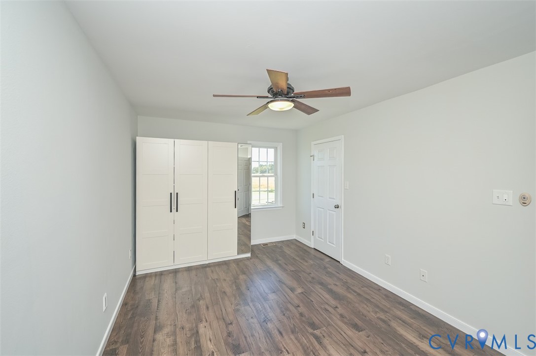 8441 Buffin Road Henrico, VA 23231 - Photo 28 of 50 a view of a room with wooden floor and a ceiling fan