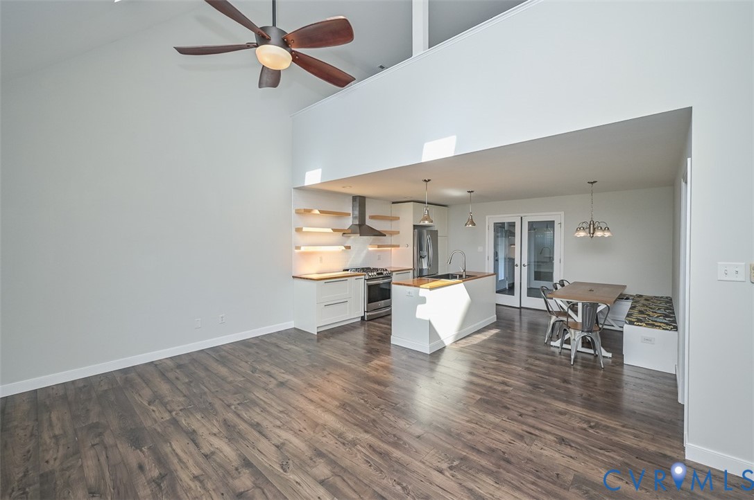 8441 Buffin Road Henrico, VA 23231 - Photo 3 of 50 a living room with couches chairs and kitchen view with wooden floor