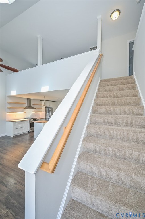 8441 Buffin Road Henrico, VA 23231 - Photo 35 of 50 a hallway with stairs and wooden floor